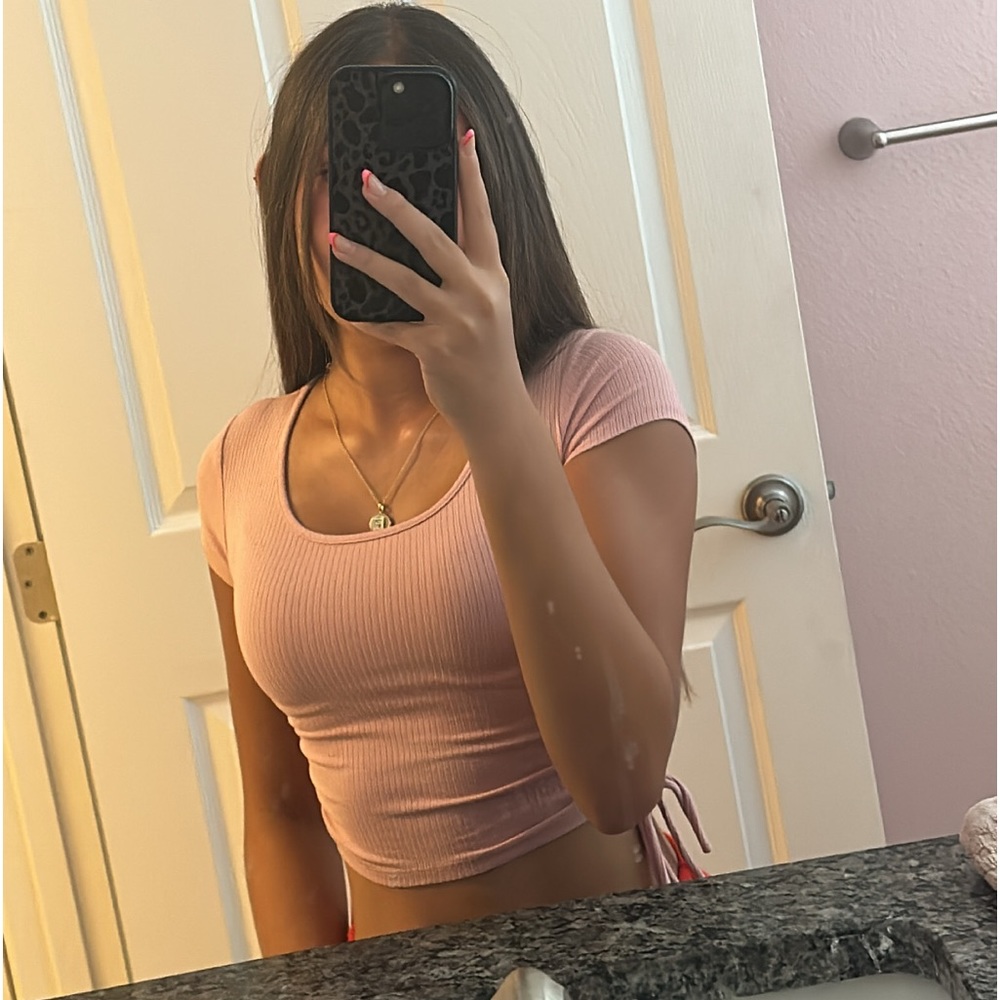 pink cropped top